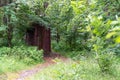 A wooden building of a toilet or toilet in a remote forest in a National Park in Russia on the Curonian Spit Royalty Free Stock Photo