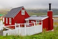 Wooden buildings in the port city of Seydisfjordur located by the fjord, Iceland