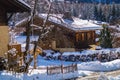 Wooden buildings with the rooftops covered in heavy snow in France Royalty Free Stock Photo