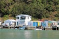 Wooden buildings on shore of Ivey Bay, Paremata NZ Royalty Free Stock Photo