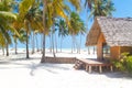 Wooden bungalow on tropical white sandy beach Royalty Free Stock Photo