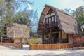 Wooden bungalow on white sand beach in tropical paradise. Wooden cottage with a reed roof on the island of Gili Meno in Indonesia.