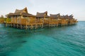 wooden bungalows over turquoise sea water Royalty Free Stock Photo