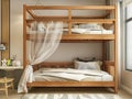 Wooden bunk bed with curtains white sheets and cat Royalty Free Stock Photo