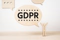 Wooden businessman icon with GDPR concept