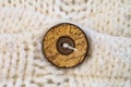 Wooden button on the knitted wool cardigan sweater