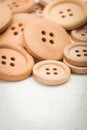 Wooden buttons on fabric