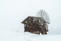 Wooden cabin in the austrian alps, covered with snow Royalty Free Stock Photo