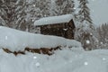 Wooden cabin in the austrian alps, covered with snow Royalty Free Stock Photo