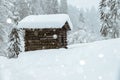 Wooden cabin in the austrian alps, covered with snow Royalty Free Stock Photo