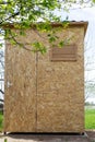 Wooden cabin in the garden for taking a summer shower. Construction Royalty Free Stock Photo