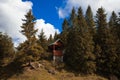 Wooden cabin in highland forest wilderness nature environment autumn pine trees natural picturesque