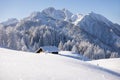 Wooden cabin or hut in the mountains in winter in the Austrian Alps. Royalty Free Stock Photo