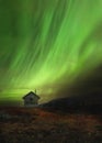 Wooden cabin in norwegian mountains called Sylan. Beautiful Aurora Borealis Royalty Free Stock Photo