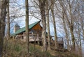 Wooden cabin in spring woods Royalty Free Stock Photo