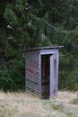 Wooden Cabin - Toilet in the woods in nature Royalty Free Stock Photo