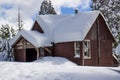 Cabin With Snow Piled Up On Roof Royalty Free Stock Photo