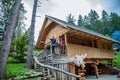 Wooden cabin with tourists at Hija Glamping Lake Bloke in Nova Vas, Slovenia