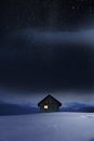 Wooden Cabin in winter holidays with Christmas tree Royalty Free Stock Photo