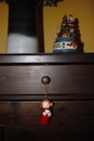 Wooden cabinet with Christmas decorations and christmas muggle carousel