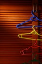 Wooden cabinet door with linked hangers on its metal handle Royalty Free Stock Photo