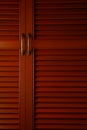 Wooden cabinet door with metal handle Royalty Free Stock Photo
