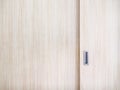 Wooden cabinet slide door with the metal handle Royalty Free Stock Photo