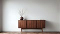 A wooden cabinet standing against a plain empty wall in a minimalist setting Royalty Free Stock Photo