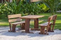 Wooden cafe table and chairs on a tropical beach, Thailand. Holiday and summer concept Royalty Free Stock Photo