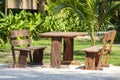 Wooden cafe table and chairs on a tropical beach, Thailand. Holiday concept Royalty Free Stock Photo