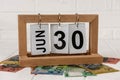 Wooden calendar with australian dollar banknotes closeup Royalty Free Stock Photo