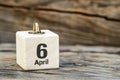 wooden calendar with date 6 april on wooden background, International Tartan Day; International Carbonara Day; World