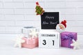 Wooden calendar with the date December 31st with holiday decorations. Royalty Free Stock Photo