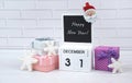 Wooden calendar with the date December 31st with holiday decorations. Royalty Free Stock Photo