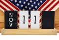 Wooden calendar with date of November 11. Veterans Day .