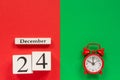 Calendar December 24th and red alarm clock