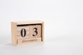 Wooden calendar December 03 on a white background