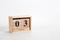 Wooden calendar June 03 on a white background