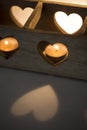 Wooden candlestick with notches in the shape of hearts