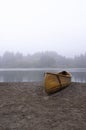 A wooden canoe on a beach Royalty Free Stock Photo