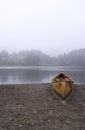 A wooden canoe on a beach Royalty Free Stock Photo