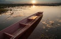 Wooden canoe on lake sunset background fishing boats Asia