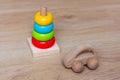 Wooden Car and stacking toy. Development games for children. Colorful pyramid and simple automobile