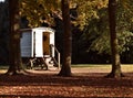 Wooden Caravan Gypsy Style in Autumn Woods Royalty Free Stock Photo