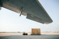 Cargo container is being carried to airplane