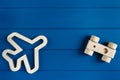 Wooden cars and plane on classic blue background. Set of colorful toys for games in kindergarten, preschool kids. Close up, Royalty Free Stock Photo