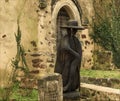 Wooden carved figure outside an ancient church