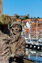 Wooden carved memorial to shipbuilders in Whitby Marina