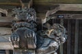 Wooden carved Shishi Lion Nosing at Honden (Main Hall) of Arakura Fuji Sengen shrine. Japan.