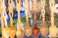 Wooden carved spoons hanging at Romanian traditional fair Royalty Free Stock Photo